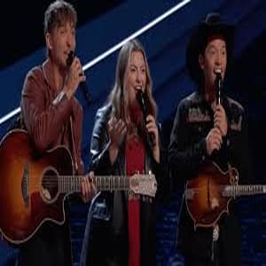 DEK of Hearts trio; Emily Clapp, Kollin Bailey, and Dylan John — performing on The Voice Season 28 blind auditions.