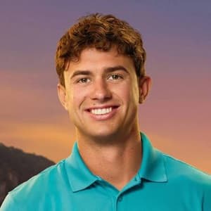 Matthew Fitzpatrick-Buck standing in front of a colorful sunset for his Below Deck Season 13 cast portrait