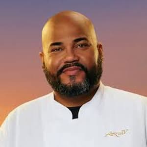 Chef Moe Vilomar posing for his official Below Deck Season 13 cast portrait